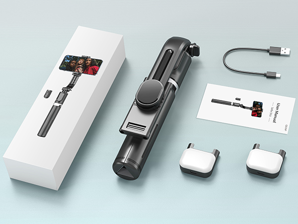 Handheld gimbal stabilizer set including main device, charging cable, two counterweights, instruction manual, and product box. The stabilizer is black with a phone mount.