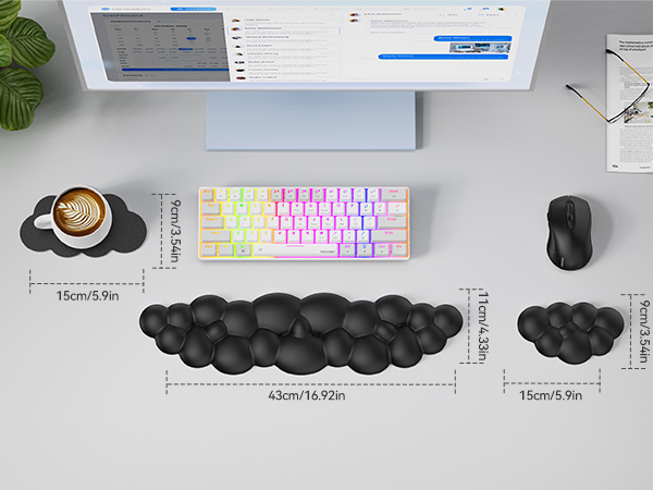 Ergonomic desk setup featuring a colorful backlit keyboard, wireless mouse, and three black cushioned wrist rests of varying sizes. Measurements for each wrist rest are shown.