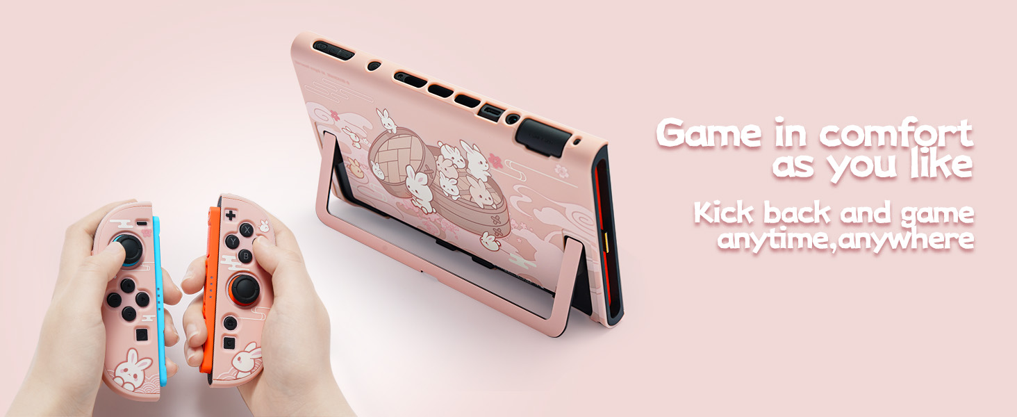 Text reads 'Control perfecto a tu manera con este pack para tu consola.' Gaming device shown in pink color scheme with detachable controls.