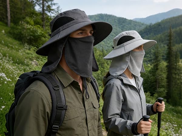 Hiking pair with sun hats: Man (gray), woman (light gray). Poles, lake/hills. Adventure gear.