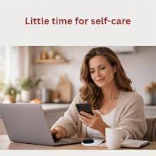 Woman working on a laptop with an electric scalp care brush nearby