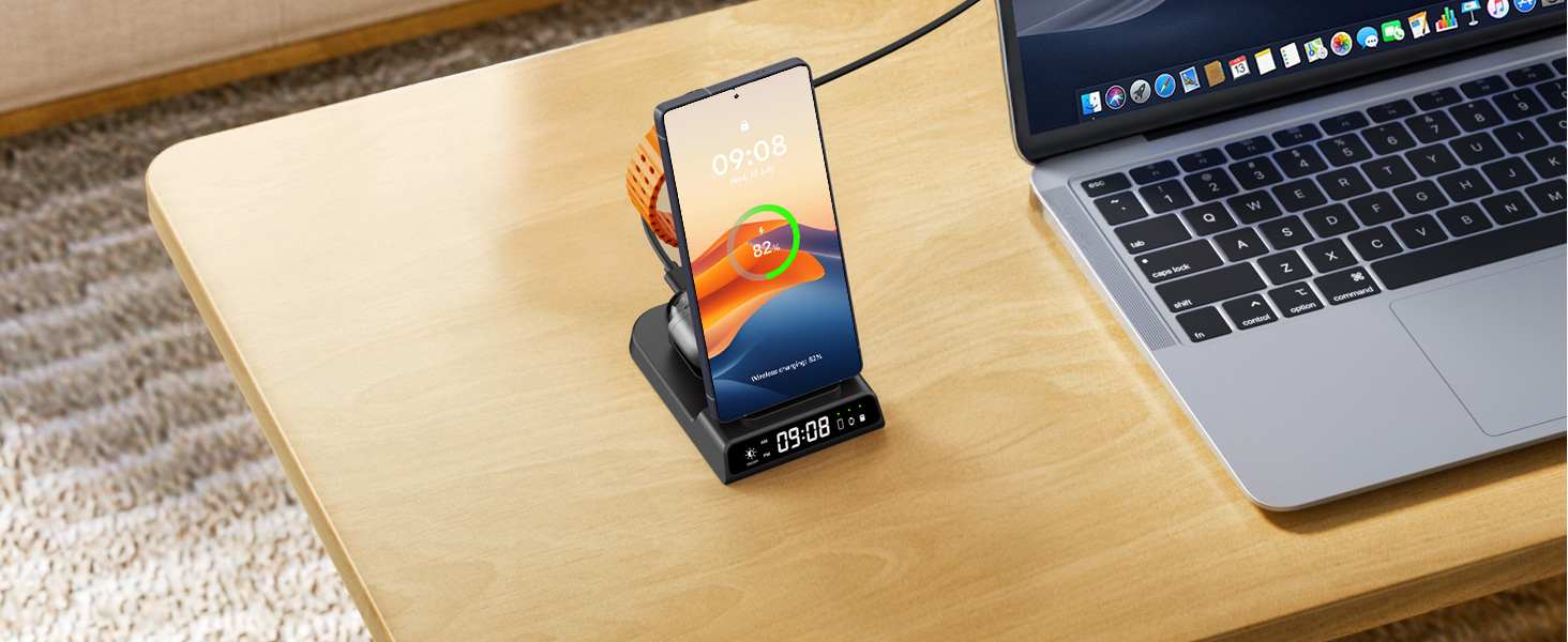 Desktop workspace setup showing a laptop, notebook, and other office supplies arranged on a wooden surface.