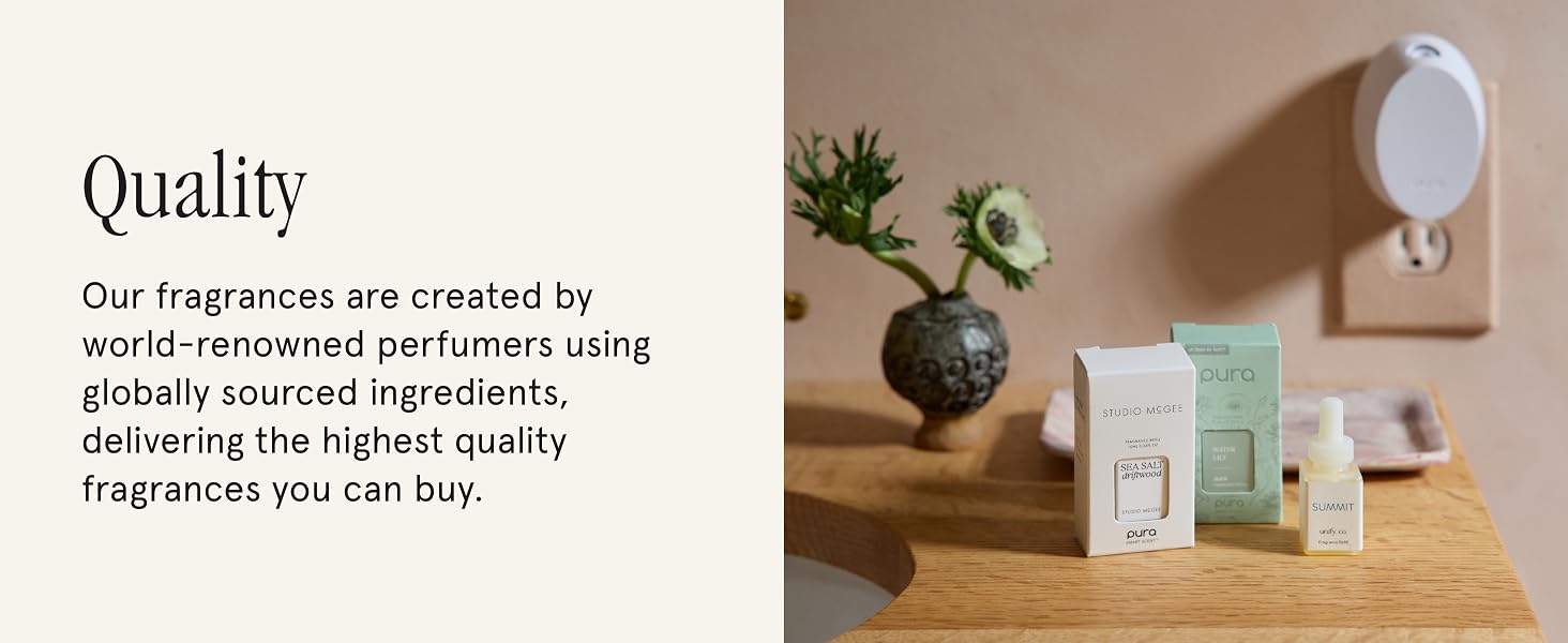 Pura Mini Plugged into the wall with Pura Fragrances on the tabletop 
