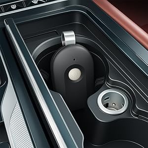 The compact RUNQUN garage remote fits perfectly in a car&amp;#39;s center console cup holder.