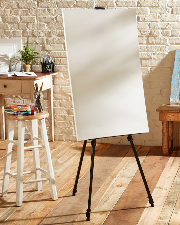 Kingart easel with palette and paint brushes; art studio scene