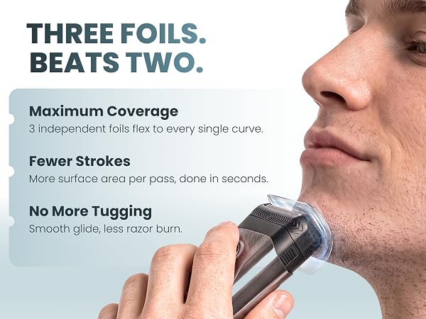 A young man shaving his chin with an electric foil razor