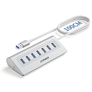 Sleek silver USB hub with multiple USB 3.0 ports shown from different angles. Features slim aluminum design with blue port indicators.