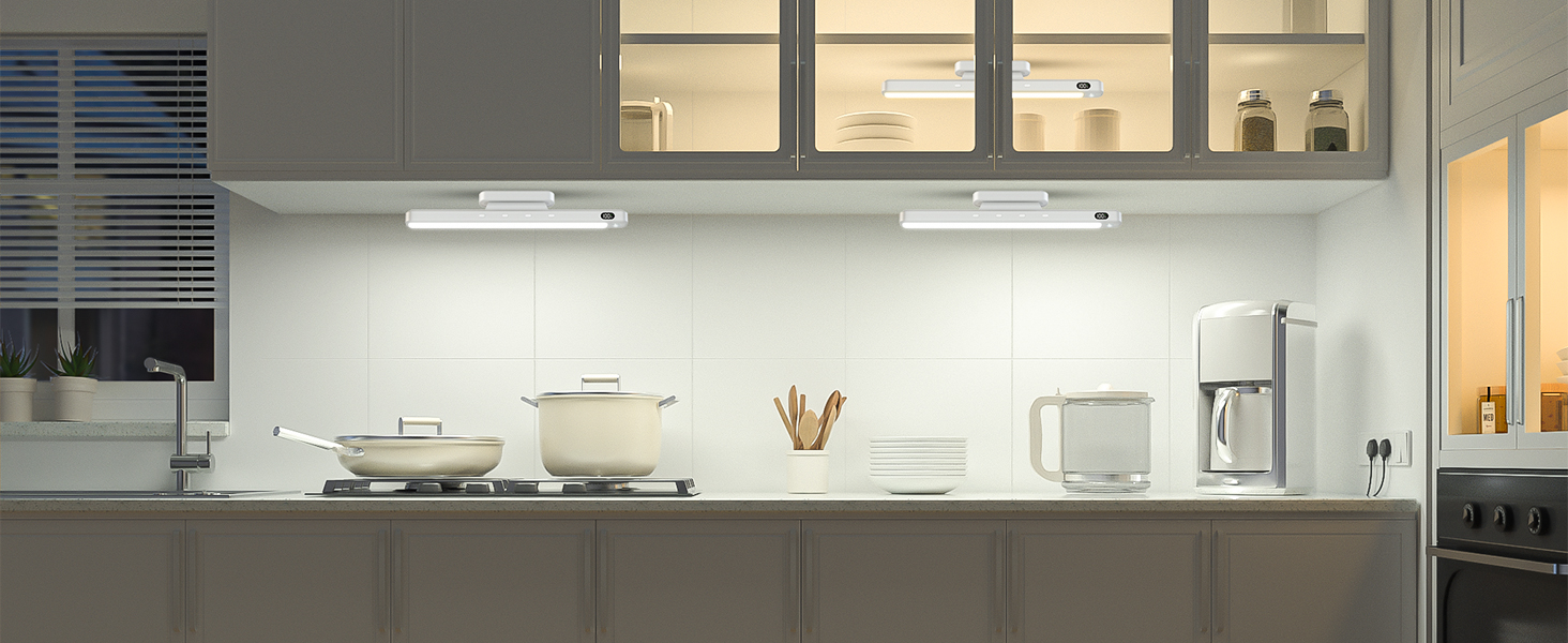 Modern kitchen interior with stainless steel appliances, white cabinets, and minimalist design aesthetic.