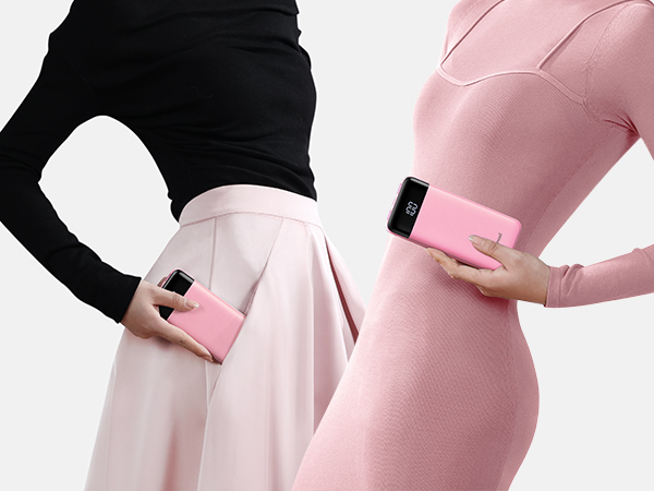 two women in pink holding a pink cell phone.