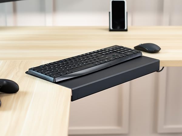 black corner connector on light wood desktop