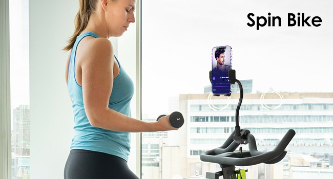 Text reads 'Spin Bike'. Series of photos showing indoor cycling setup and person exercising on stationary bike in bright fitness space.