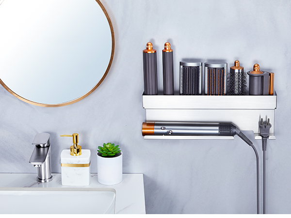 Bathroom storage solution showcasing wall-mounted metal shelving units in chrome finish, displaying organized toiletries and decorative items.
