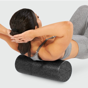 Woman using ProsourceFit High Density Foam Roller 18 x 6-inches