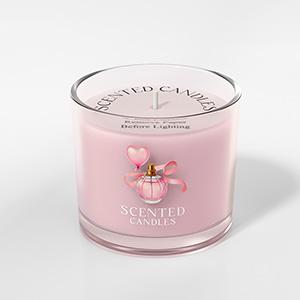 Pink scented candle in clear glass jar with floral design on label.