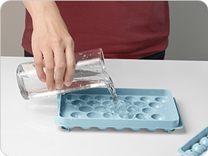 The first step of ice making is pour water into the tray