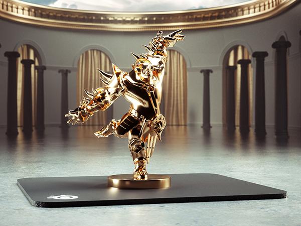 -Golden orc trophy on top of SteelSeries QcK mousepad