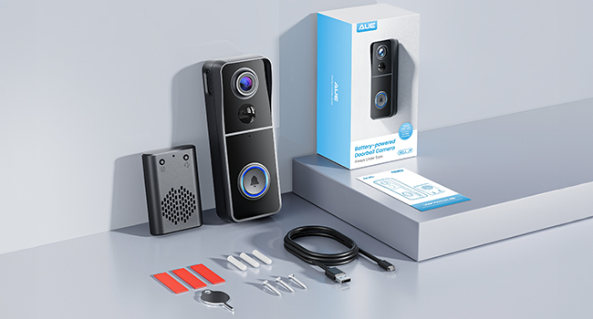 Video doorbell product display with main unit, mounting hardware, and retail packaging. Shows camera lens and speaker grille on black device face.