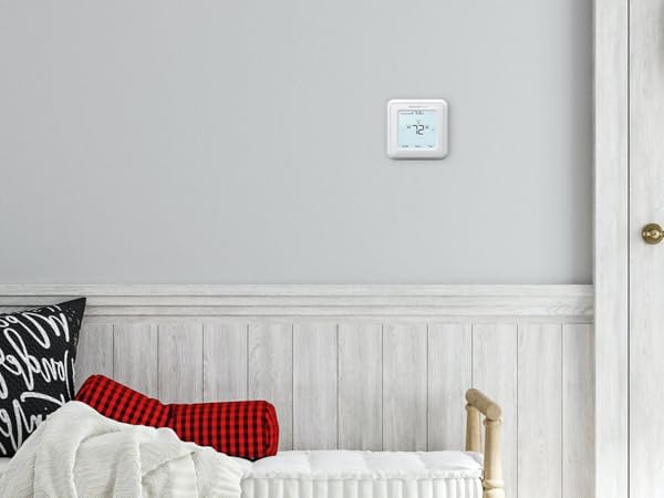 Thermostat installed on wall in home