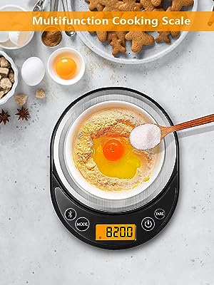 Digital kitchen scale displaying 820g, with a bowl containing egg and flour mixture. Surrounding ingredients include nuts, spices, and eggs on a light surface.