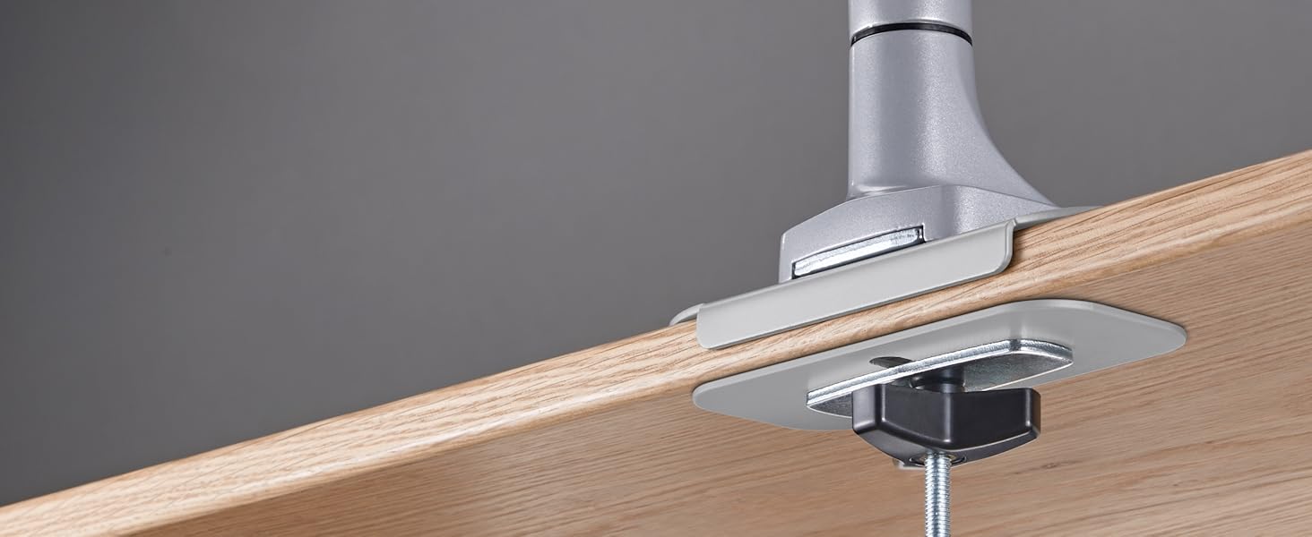 A flush grommet installation allows the desk to sit against the wall