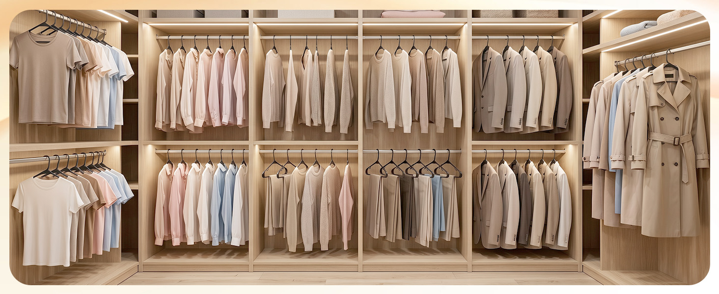 Walk-in closet organized with 50 black plastic hangers. Matching hangers create calm, boutique feel