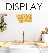 State-shaped cutting board hung on wall for display.