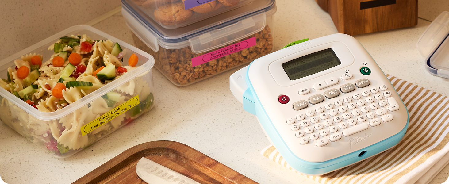 Brother P-touch PT-N25BTV3 label maker on kitchen countertop, next to labelled meal prep containers
