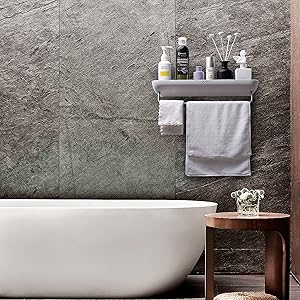 A clean, tidy bathroom with my wall-mounted shower caddy neatly holding toiletries and towels.