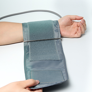 a hand holding a wrist brace