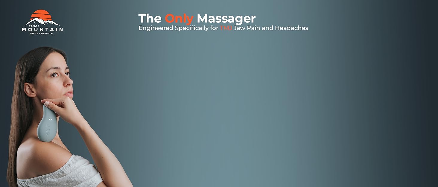 person holding the head massager up to their face