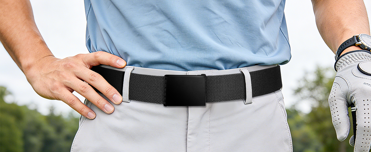 Man wearing light blue shirt and white golf glove holding black belt with white stripe, demonstrating belt product worn at waist during outdoor golfing activity.