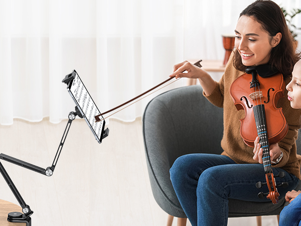 Series of images showing a musician playing violin while using an adjustable desk-mounted microphone arm stand in a bright, white-walled setting.