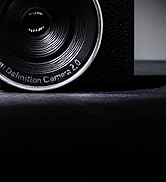 Close-up black and white images of vinyl record details, showing grooves and reflection patterns against dark background.