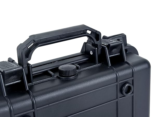 Close-up of a black, hard-shell case with a sturdy handle and locking mechanisms visible.