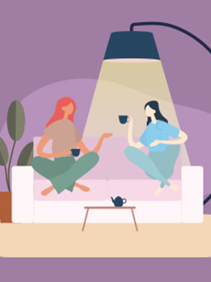 girls drinking coffee on couch