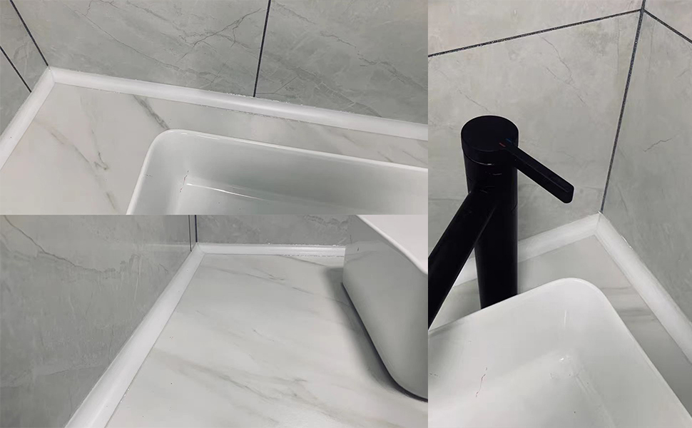 Modern bathroom sink with white basin and black faucet. Marble-like tiles on walls and countertop. Sleek design with angular features.