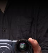 a man holding a camera in his hand