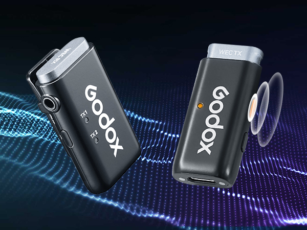 Two black Godox wireless audio transmitters with silver tops, displaying Godox logo. Devices feature buttons and ports, shown against a blue and purple abstract background.