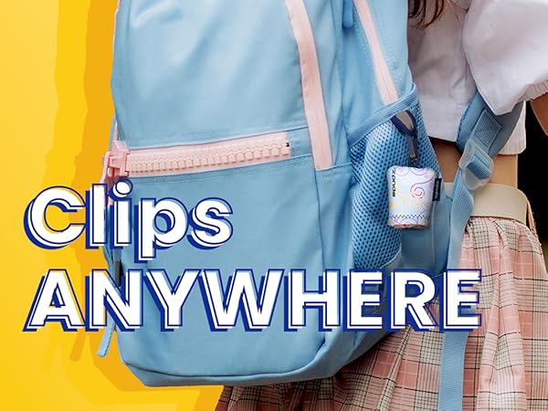 Girl with a spudz clipped to her backpack while holding moms hand to walk to school.