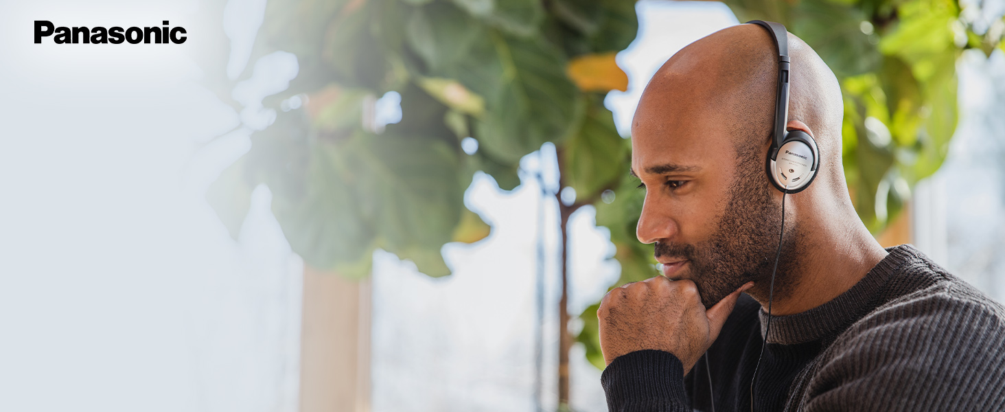 African-American man wearing the Panasonic RP-HT21 on-ear headphones