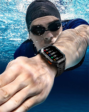 Digital smartwatch shown underwater, displaying screen interface while worn by swimmer in dark swim cap.