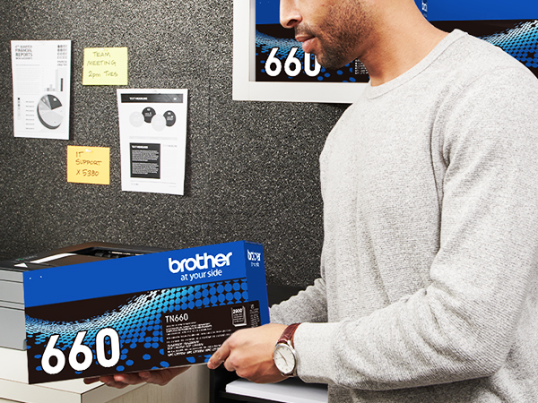 Man Holding TN660 Box