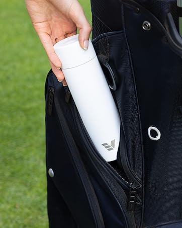 Ever Vessel Mini water bottle yellow being held by female with lid off sitiing on yellow chair