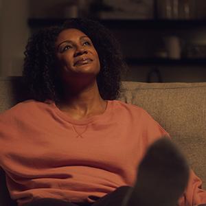 Woman sitting on couch