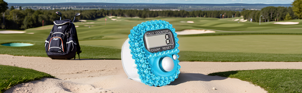 A close-up view of a golf ball on a green, with the product lying next to it.