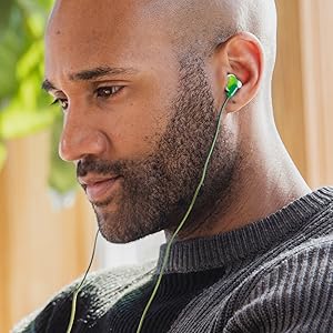 african american man listening to music wearing corded GREEN earbuds