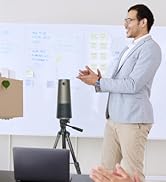 Professional presentation setup showing a laptop and tripod-mounted camera in a meeting room with whiteboard backdrop.