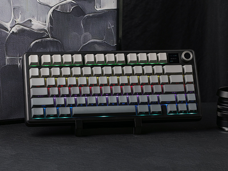 a black and silver keyboard with a black base.