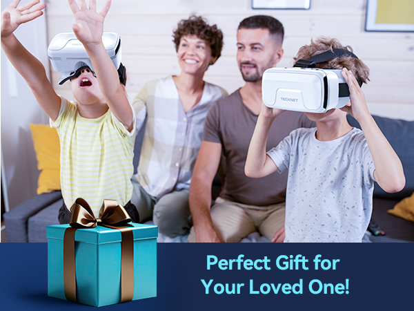 Family using virtual reality headset. Child with raised arms, adults watching. Teal gift box in foreground. Text: 'Perfect Gift for Your Loved One!'
