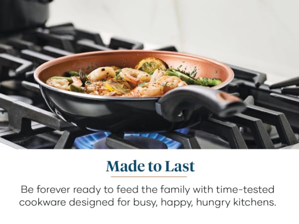 Farberware Glide skillet on gas stoetop with shrimp and asparagus